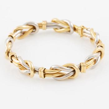 A bracelet in 18K gold and white gold.