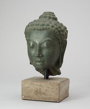 A stone head of Buddha. Thailand.