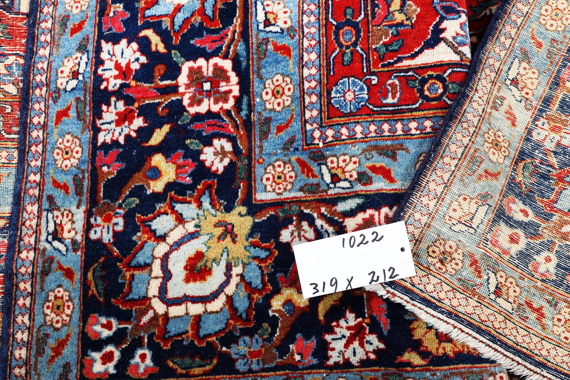 A semi.antique Kashan, c. 319 x 212 cm.