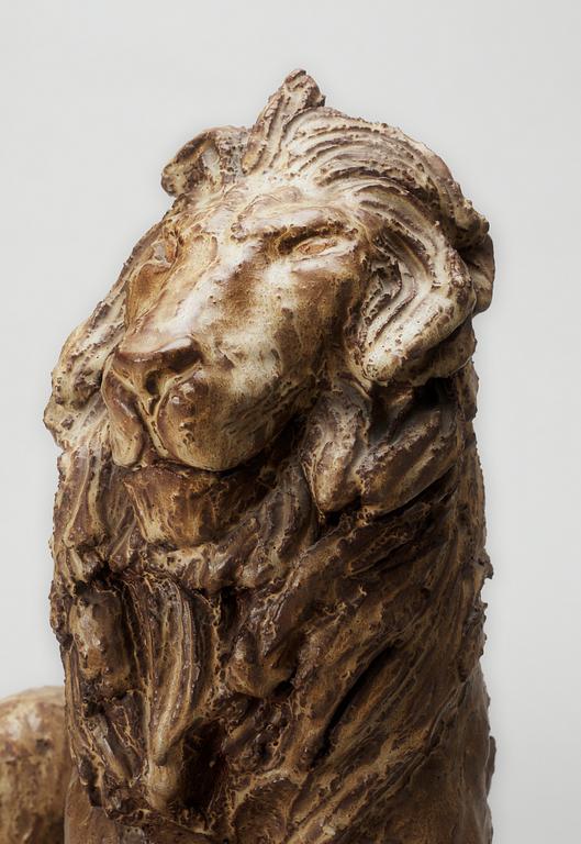 A Michael Schilkin stoneware sculpture of a lion, Arabia, Finland, 1940's.