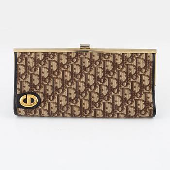 Christian Dior, a canvas clutch.
