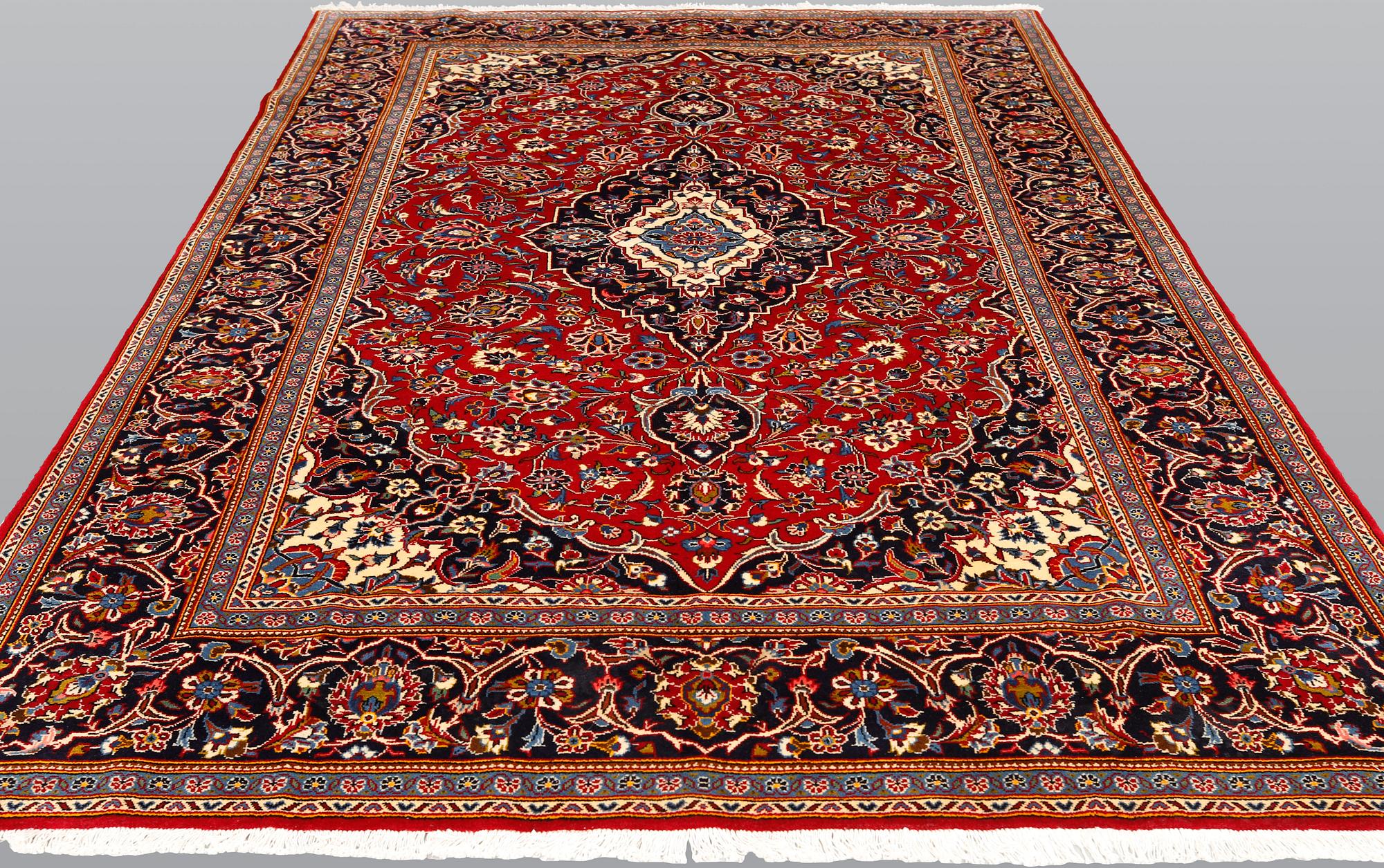 A Kashan carpet, approximately 315 x 200 cm.