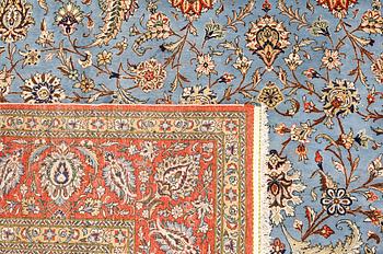 A Ghom carpet, part silk, approx. 480 x 350 cm.