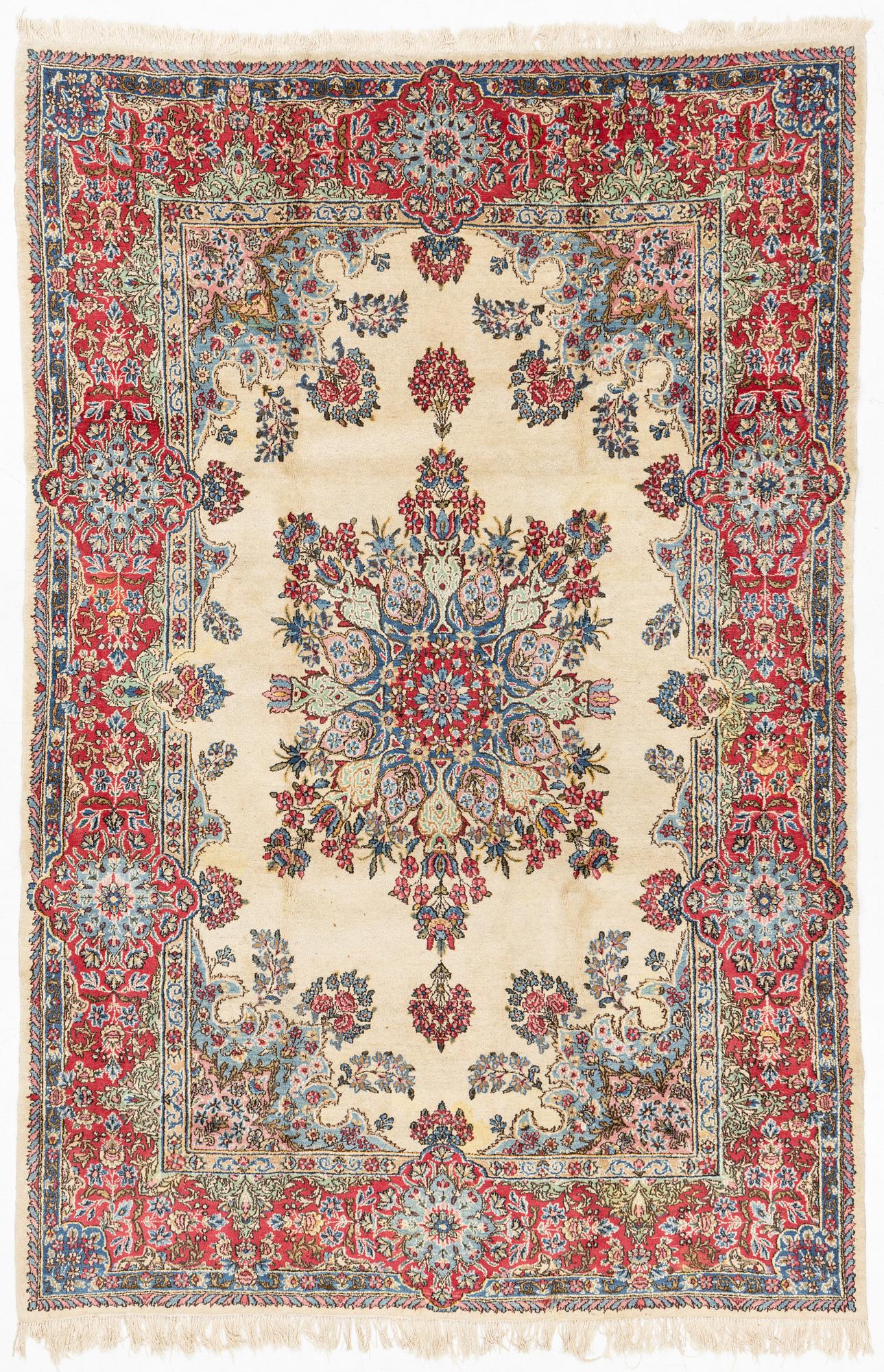 A carpet, old Kerman, approx. 314 x 210 cm.