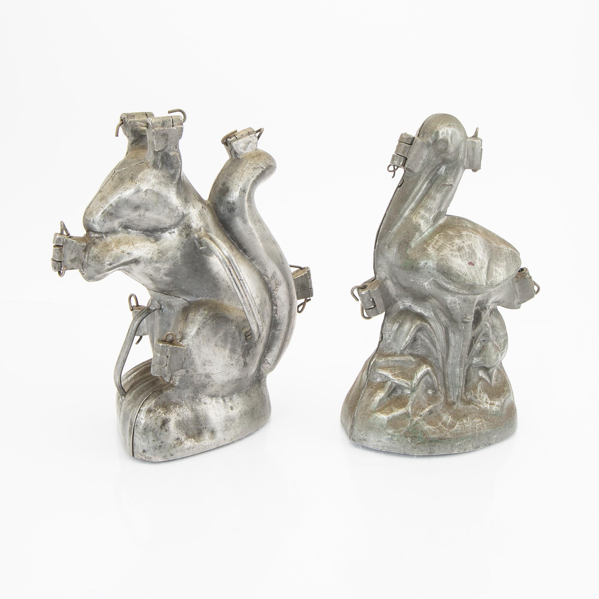 A set of four pewter icecream moulds around 1900.