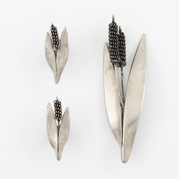 A brooch and a pair of earrings.