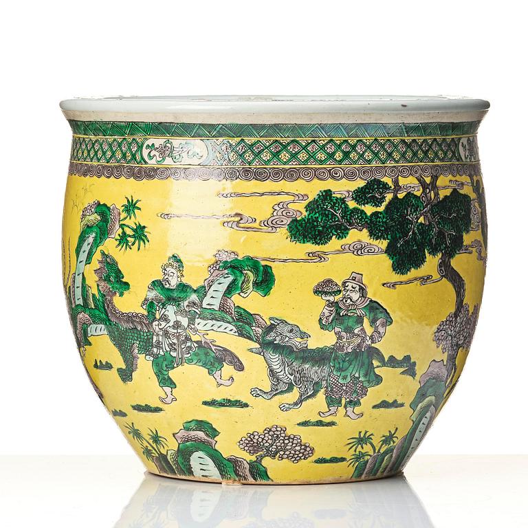 A large yellow ground famille verte bisquit jardiniere, Qing dynasty, 19th century. Marked 'Tack Loong Canton China'.