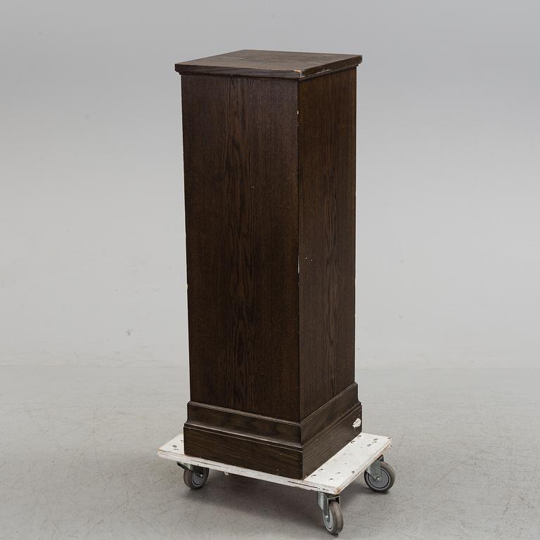 A 20th century pedestal.