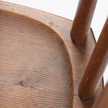 Axel Einar Hjorth, a set of four stained pine "Utö" chairs, Nordiska Kompaniet, Sweden, 1930s.