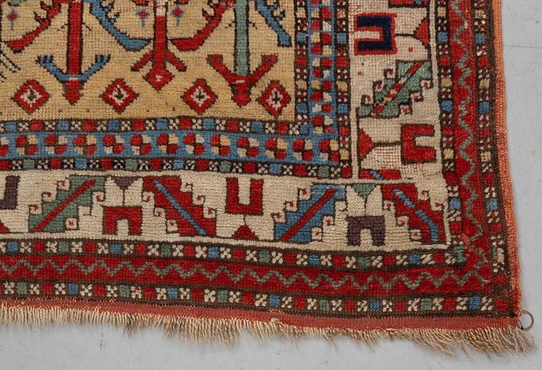A rug, antique Anatolian/Caucasian, ca 148-149 x 104,5-110 cm (as well as 1-1,5 cm flat weave at one end).