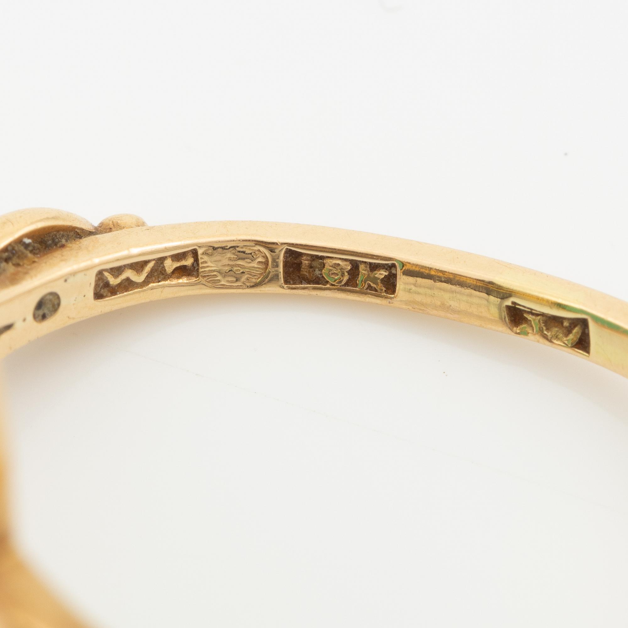 Ring 18K guld med grön sten.