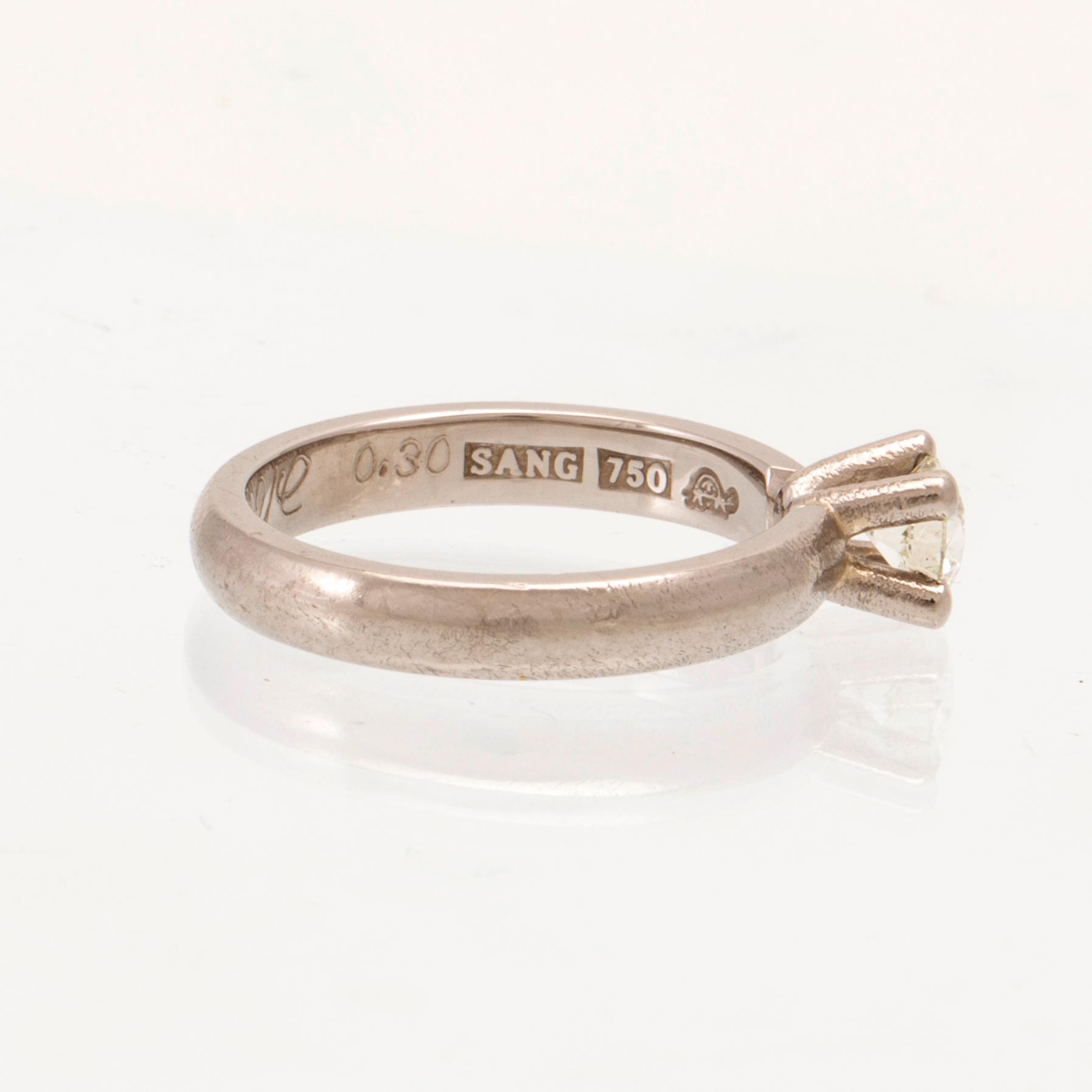 An 18K white gold solitaire ring set with a round brilliant-cut diamond, Sandberg.