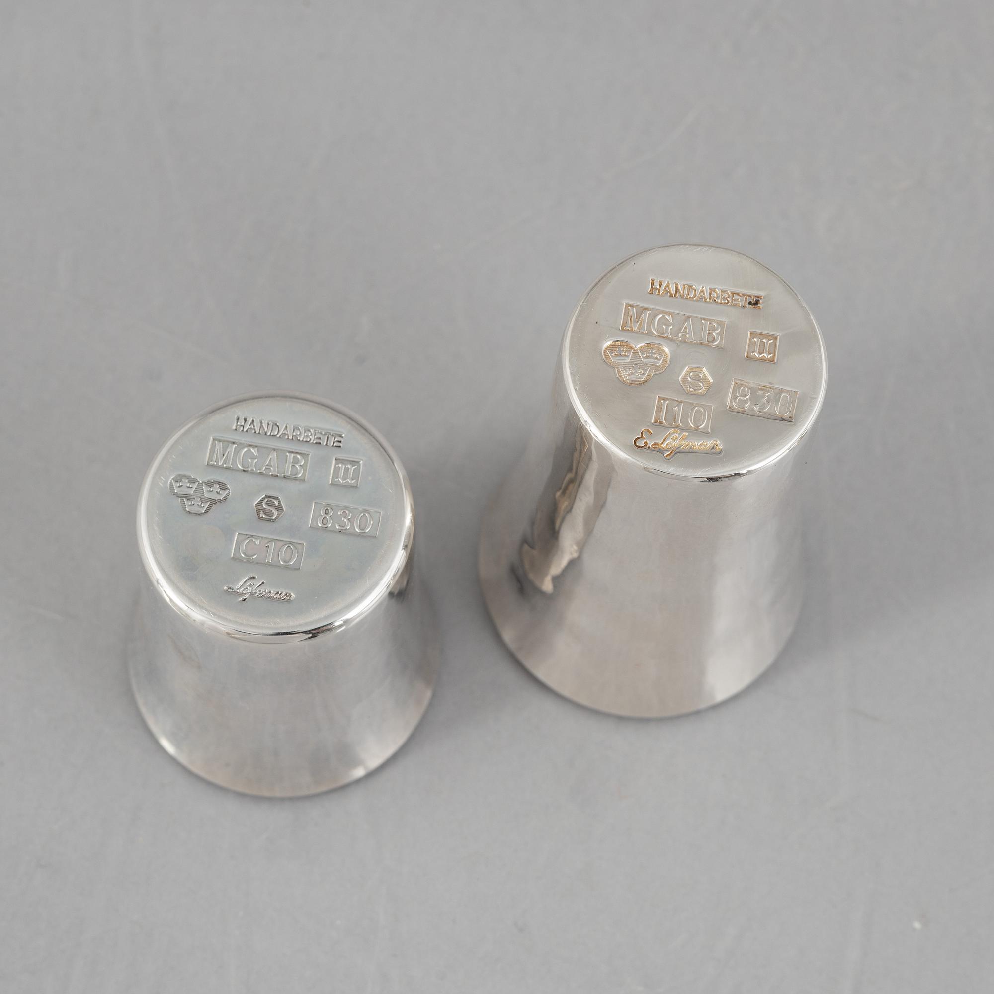 Eric Löfman, a Swedish silver candlestick, a vase and four cups, including MGAB, Uppsala 1977.