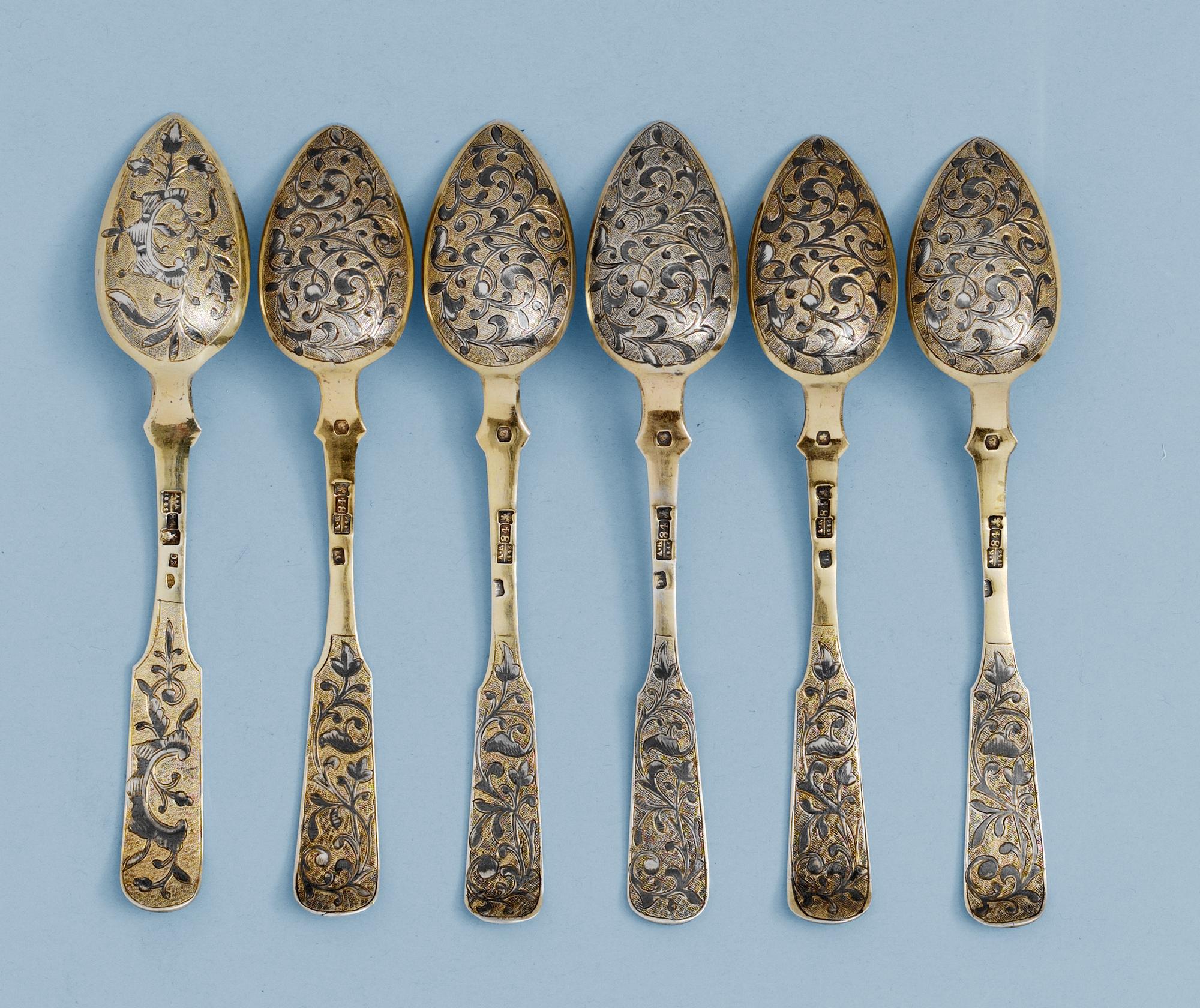 A SET OF SIX RUSSIAN SILVER-GILT AND NIELLO TEA-SPOONS, un identified makers mark, Moscow 1846.