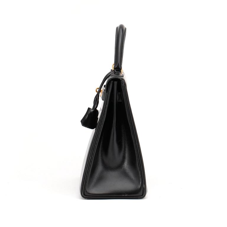 HERMÈS, a black leather bag, "Kelly 32".