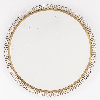 A mid 20th century brass frame mirror.