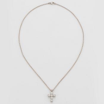 An 18K white gold cross pendant set with round brilliant-cut diamonds with a total weight of ca 1.20 cts.