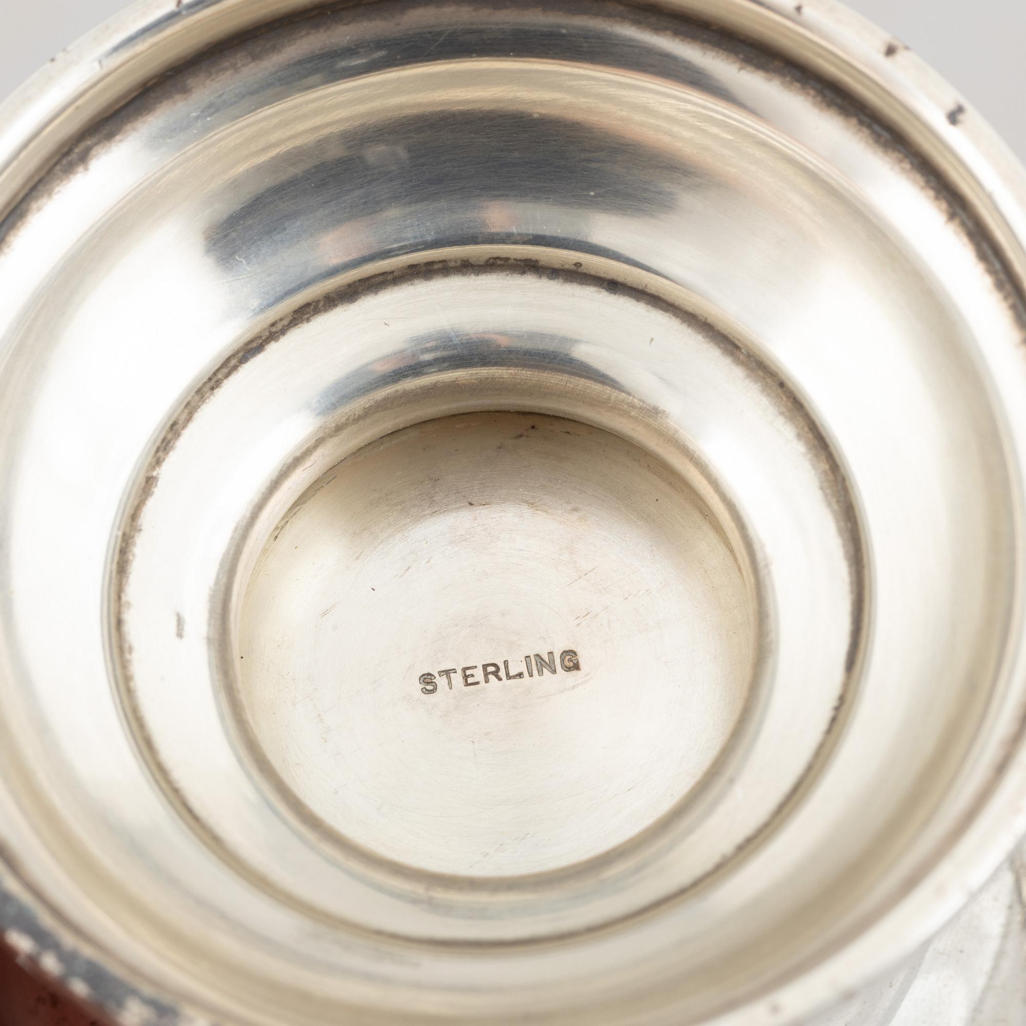 Three sterling silver shakers, 20th Century.
