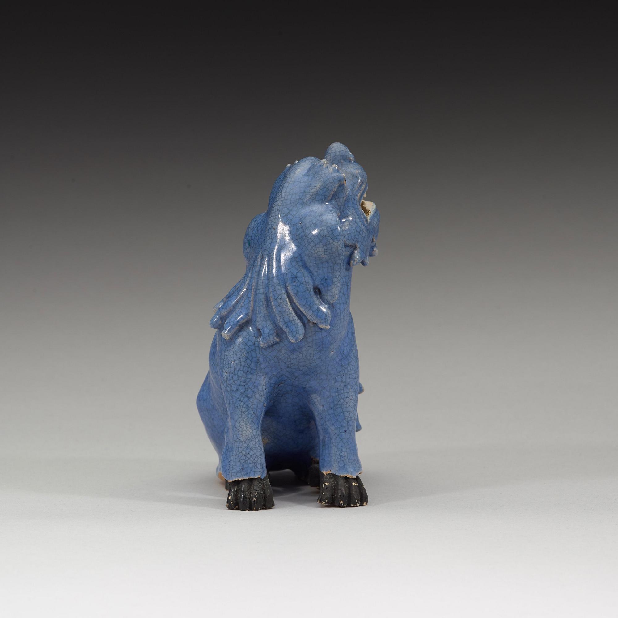 A blue glazed figure of a buddhist lion, Qing dynasty, Qianlong (1736-95).