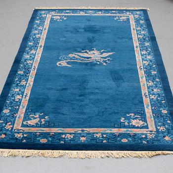 A CARPET, an old China, ca 295 x 153 cm (as well as 2 cm flat weave at the ends).