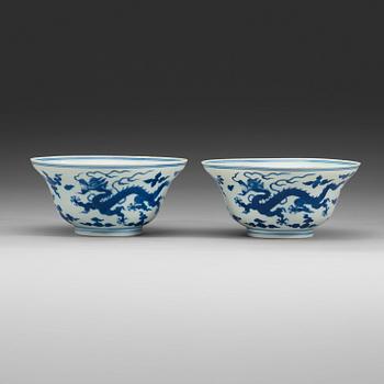 131. A pair of blue and white five clawed dragon bowls, Qing dynasty with Qianlong's sealmark and period (1736-95).