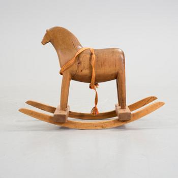 A wooden rocking horse first half of the 20th century.