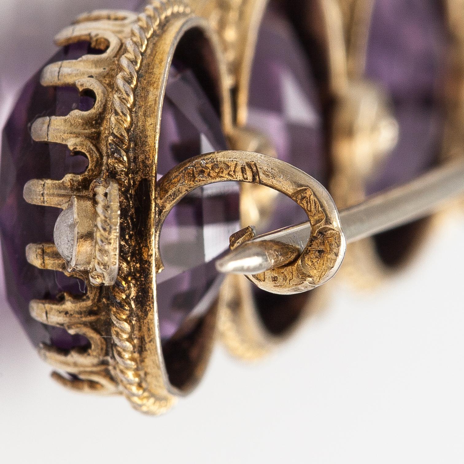 A necklace, bracelet and two brooches in gilded silver and with amethysts and pearls.