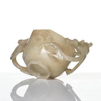 A carved nephrite cup with 'chilong' handles, late Qing dynasty/early 20th century.