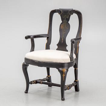 A rococo style armchair, around 1900.