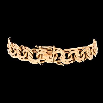 An 18K gold bracelet.