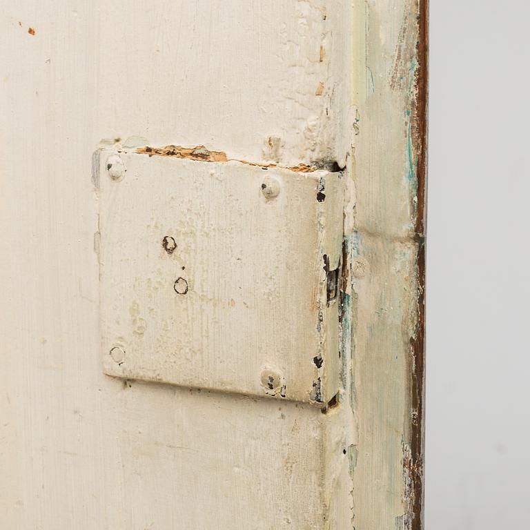 A first half of the 19th century painted corner cabinet.