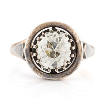 595. A 14K gold and silver ring with an old-cut diamond.