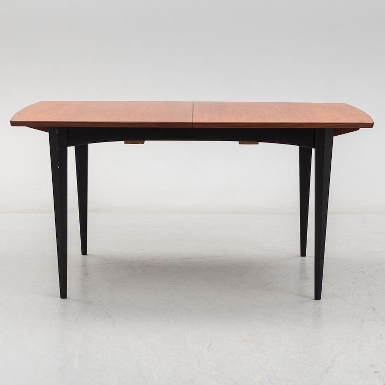 A 1950s/1960s teak and teak veneer table.