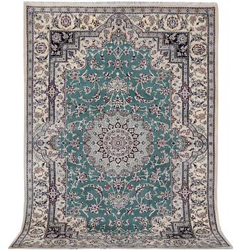 A Nain carpet, part silk, 6 laa, c. 300 x 201 cm.