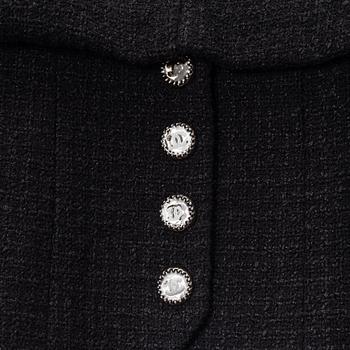 Chanel, A black bouclé jacket, size 34.