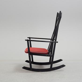 A mid 20th century rocking chair.