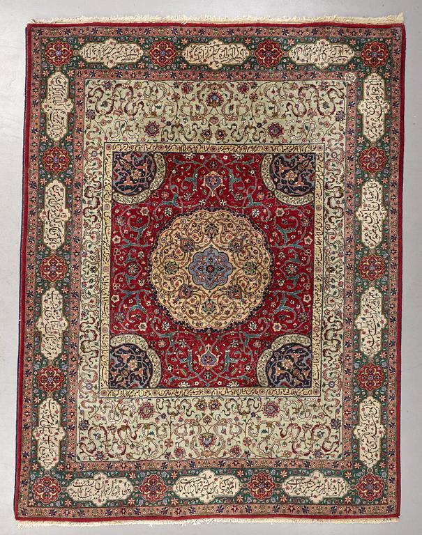 A carpet, semi-antique Tabriz, signed ca 335,5 x 256,5 - 261,5 cm.