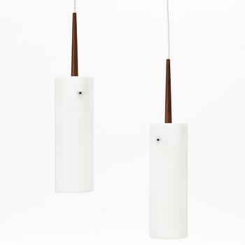 Uno & Östen Kristiansson, a pair of teak and plastic ceiling lights, Luxus, Vittsjö.