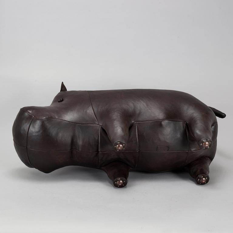 A leather footstool by Dimitri Omersa & Co.