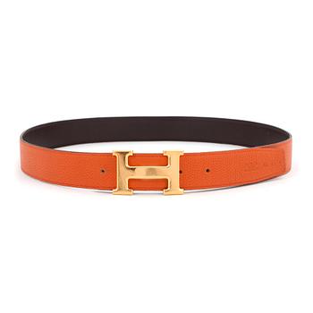 HERMÈS, a men's orange and brown leather reversibel belt.