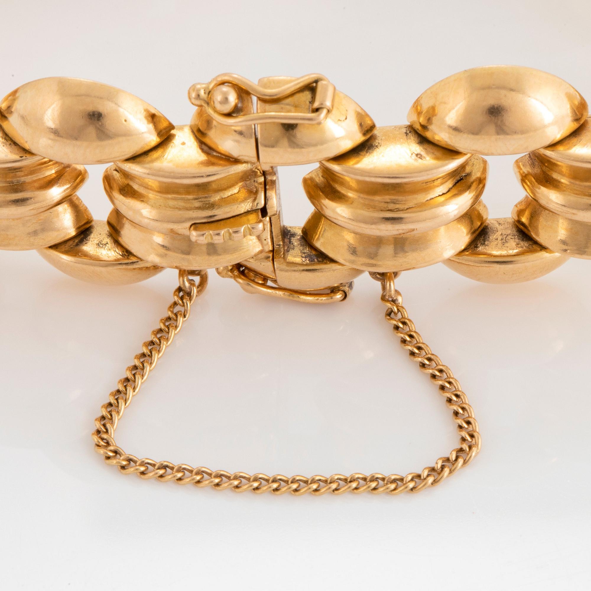 An 18K gold bracelet.