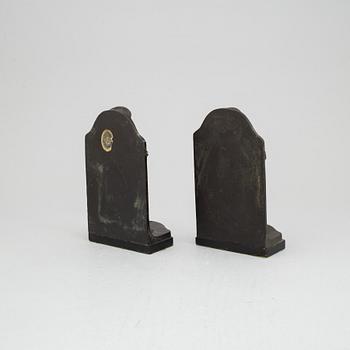 Azel Gute, a pair of bronze bookends, signed and dated 1920.