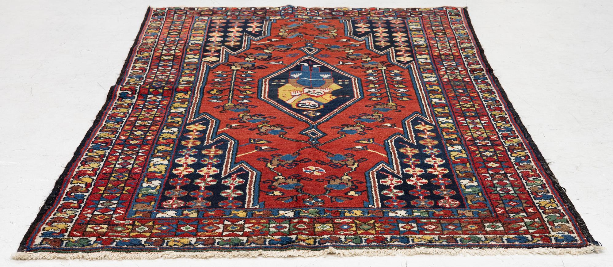 A semi-antique pictoral Mazlagan rug, Northwest Iran, c. 195 x 125 cm.