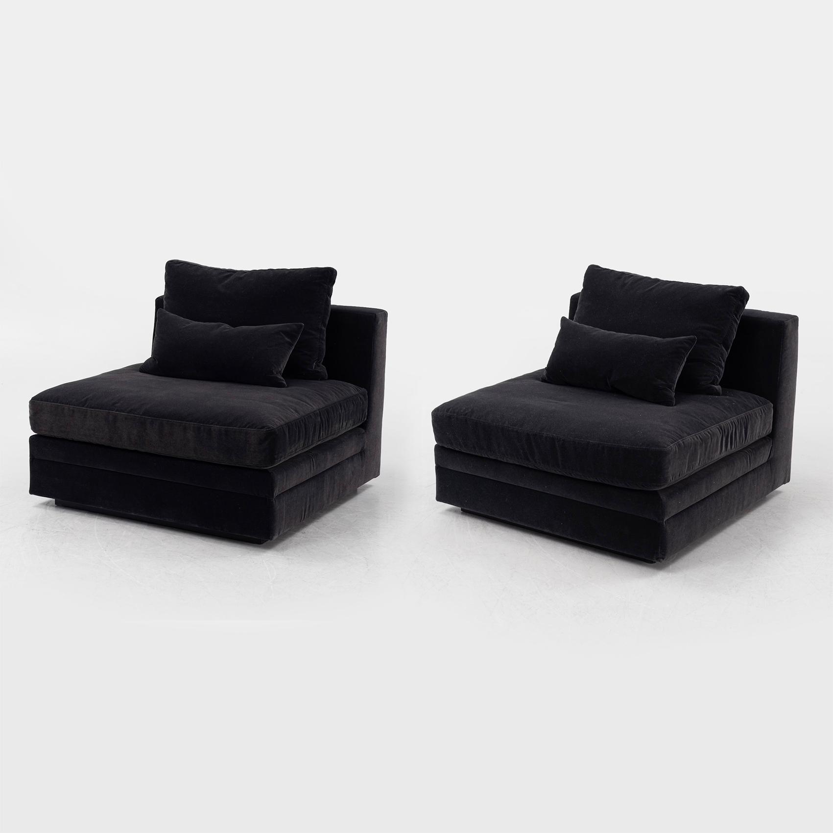 Two 21st century lounge chairs.