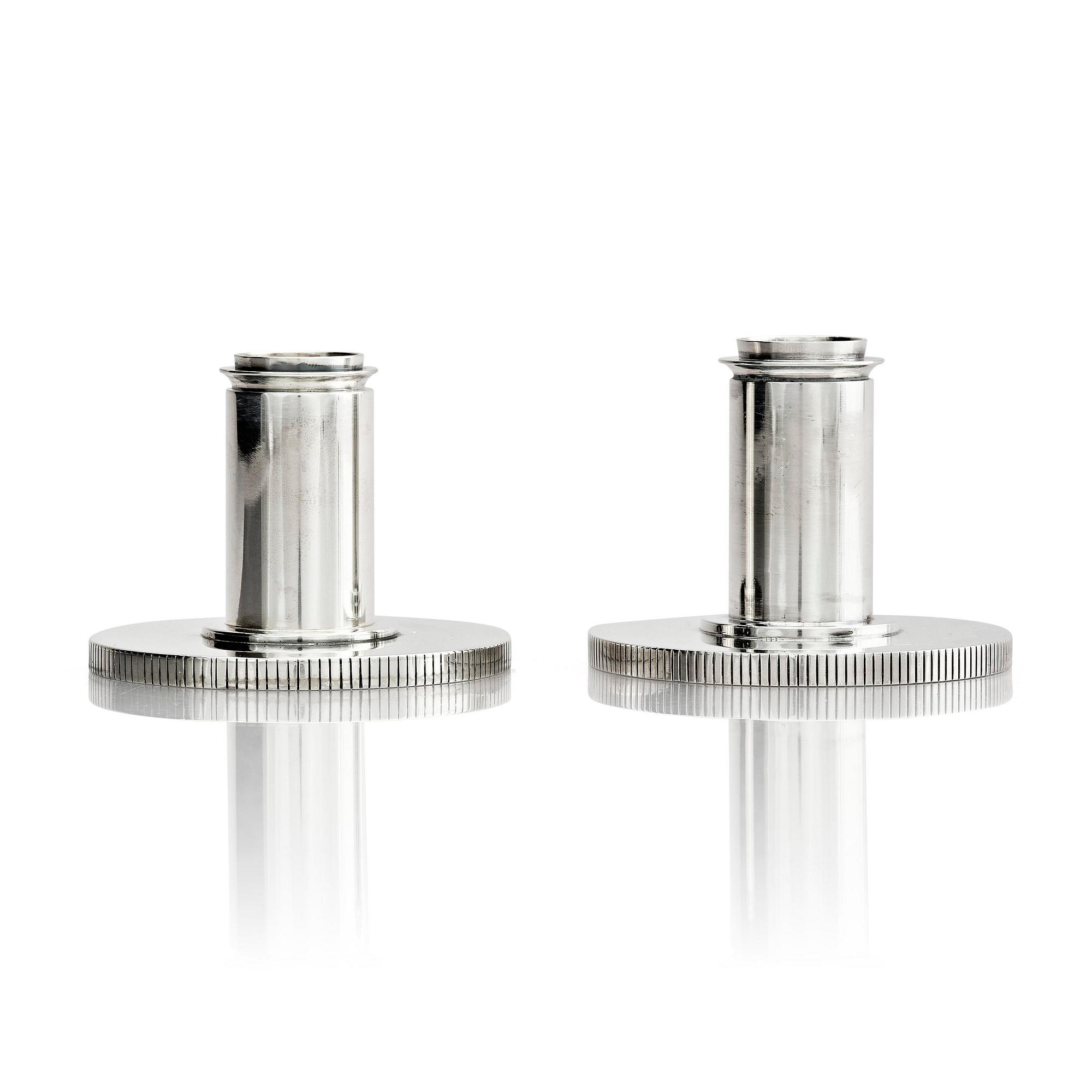 Georg Jensen, a pair of sterling silver candlesticks, design by Sigvard Bernadotte, model no 711A, Copenhagen, Denm after 1945.