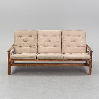 A stained pine garden sofa by Elsa Stackelberg.