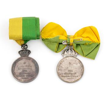 MEDALJER, 2 stycken, silver, "Kungliga Patriotiska Sällskapet", 1915 samt 1956. Total vikt ca 85,9 gram.