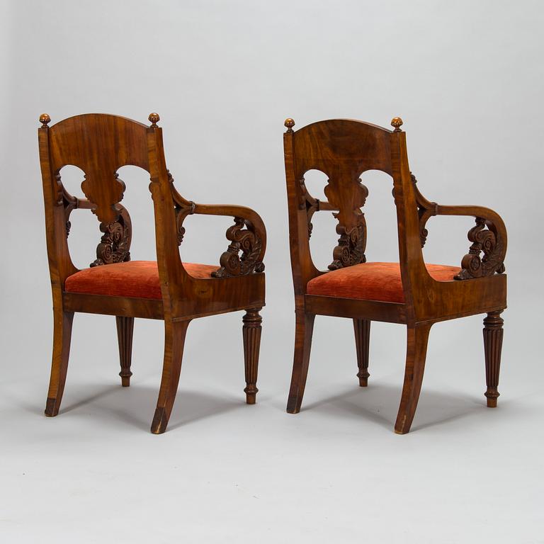 A pair of Baltic open armchairs from around 1820.