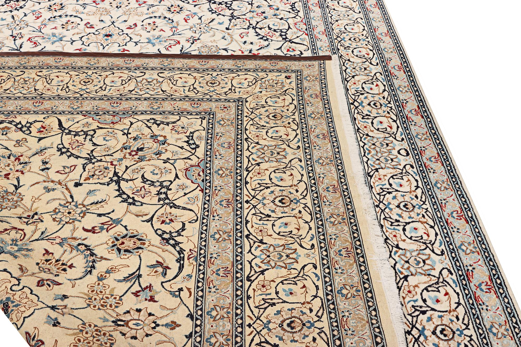 A Nain carpet, part silk, 9 laa, c. 390 x 295 cm.