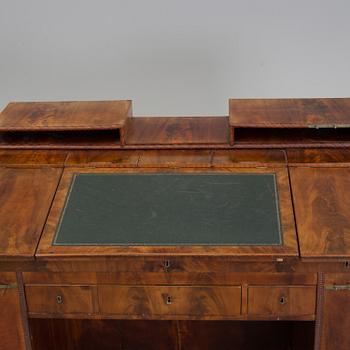 A mid 19th century writing desk and chair.